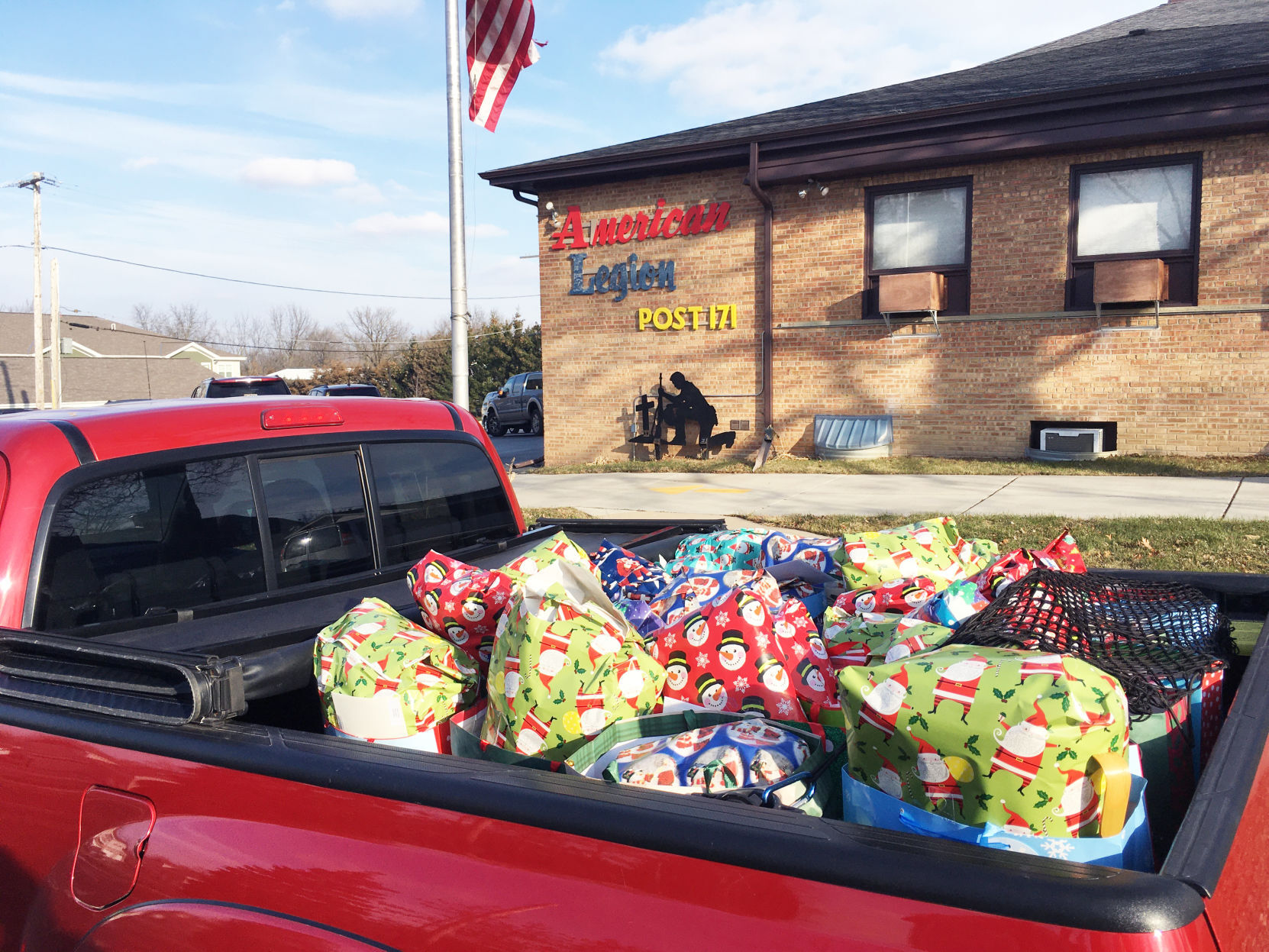 Pickup truck loaded with holiday gifts going to veterans home residents